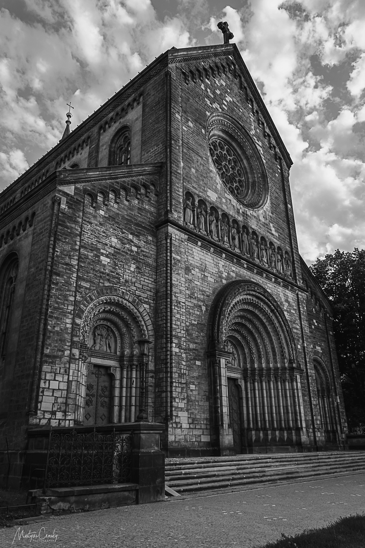 Black and white photo of a church on Karlinske namesti, in Prague during a sunny day.