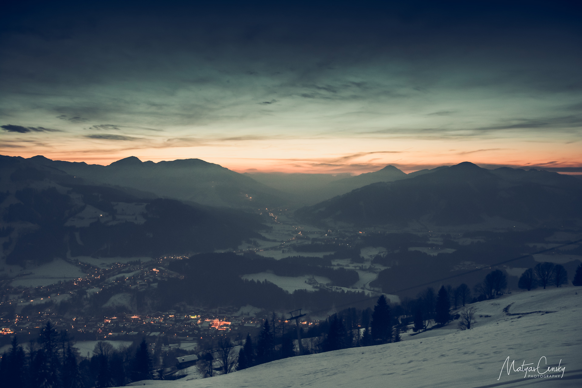 Landscape photo of sunset over Kitzbuhel, Austria during winter.