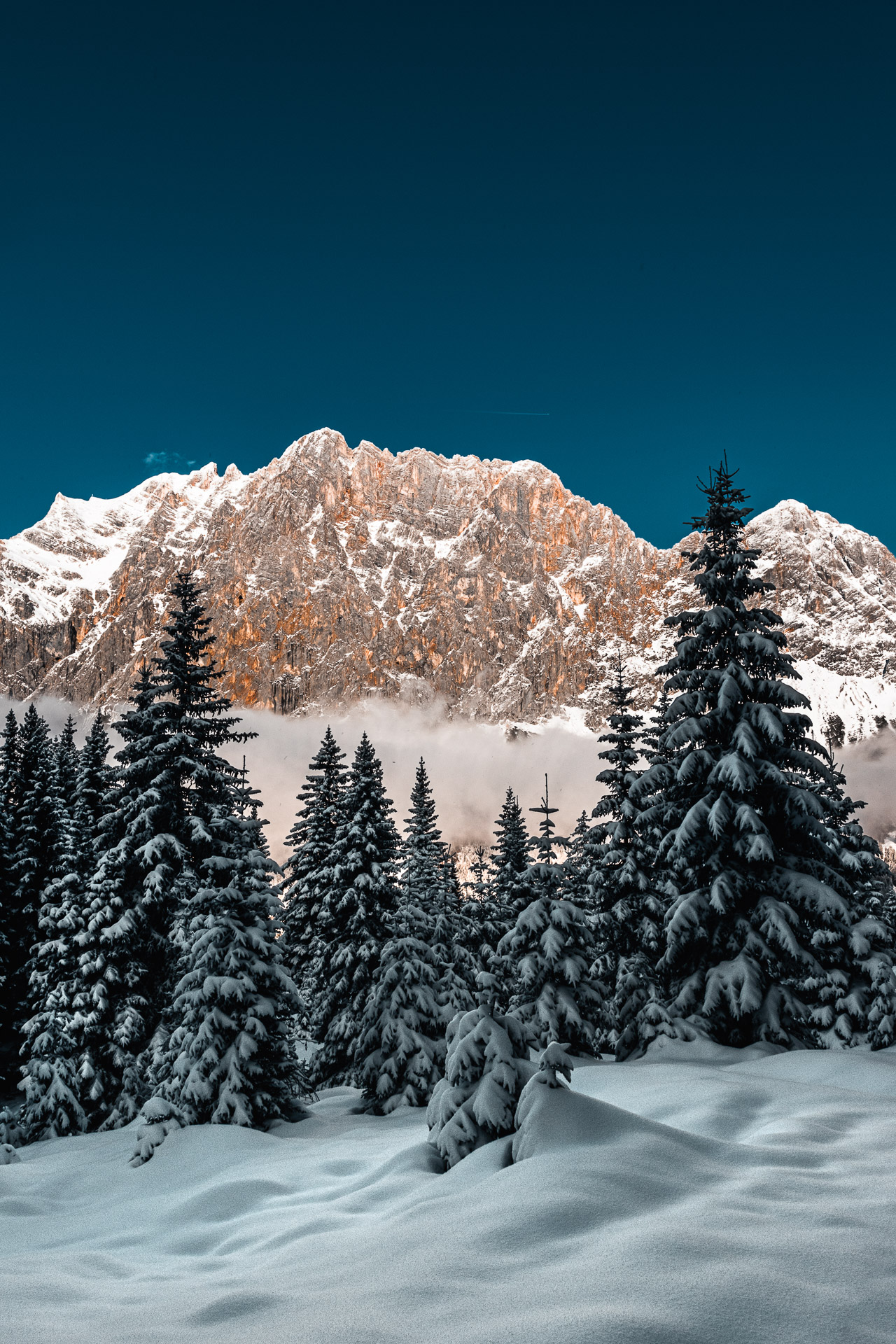 Photo of a winter scene in Austria with Zugspitze in the background.