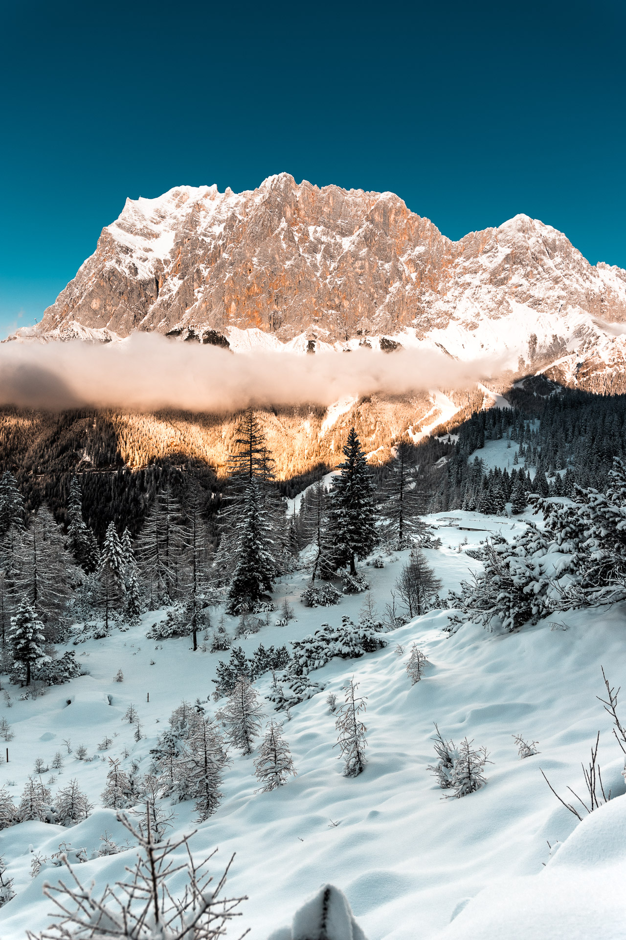Photo of a winter scene with Zugspitze in sunset, Austria.
