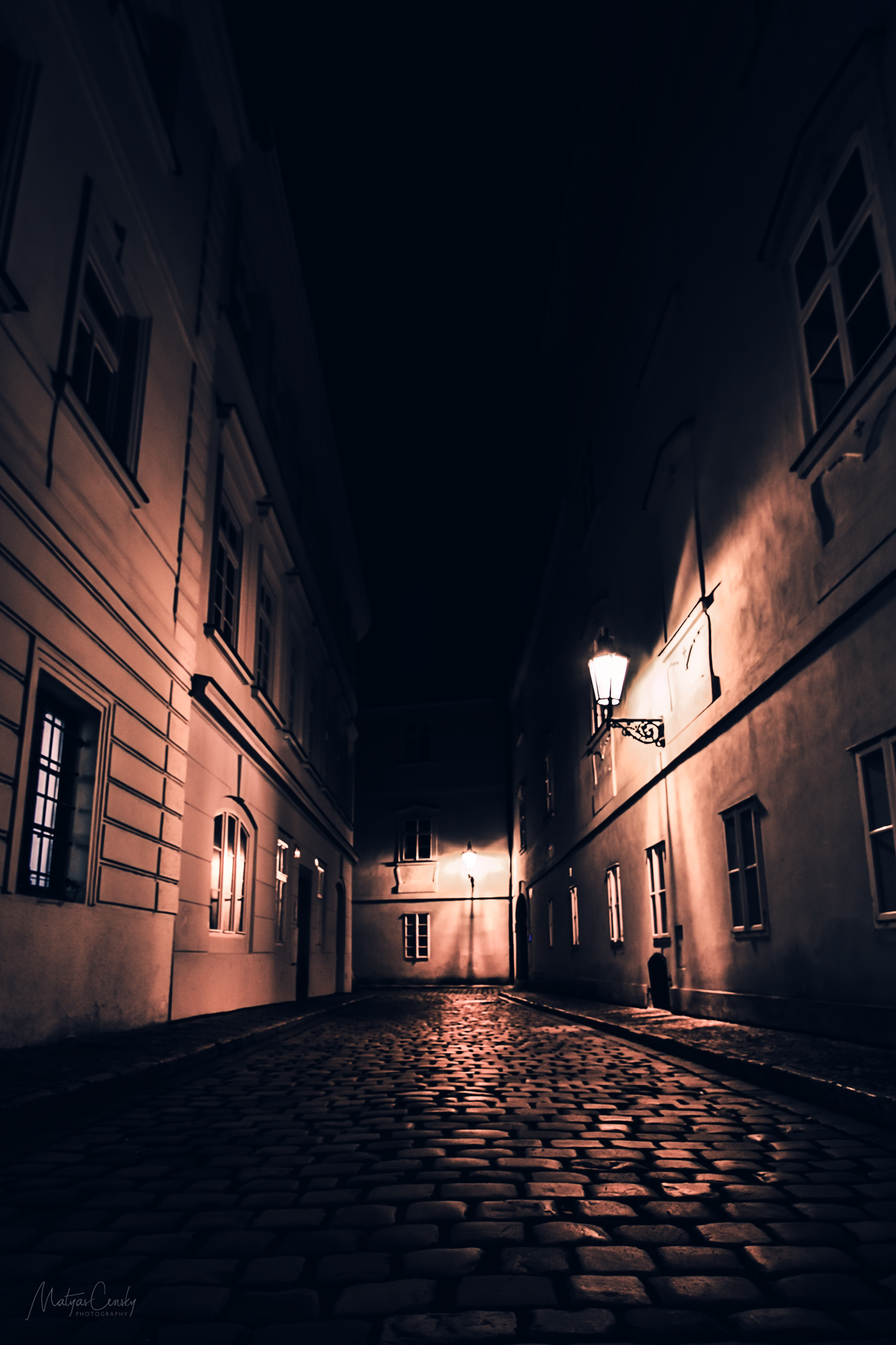 Photo of night alley situated in old town part of Prague near Kampa.